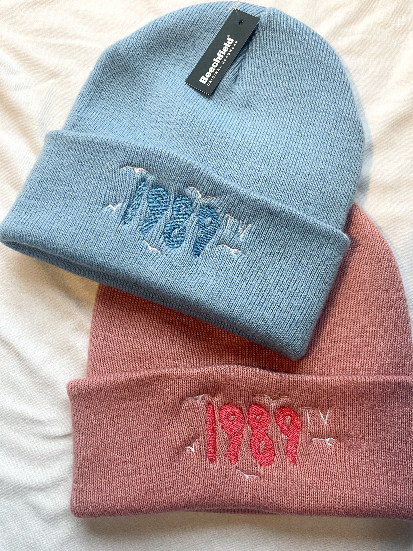 Embroidered 1989 beanie, Crystal Skies Blue, Rose Garden Pink